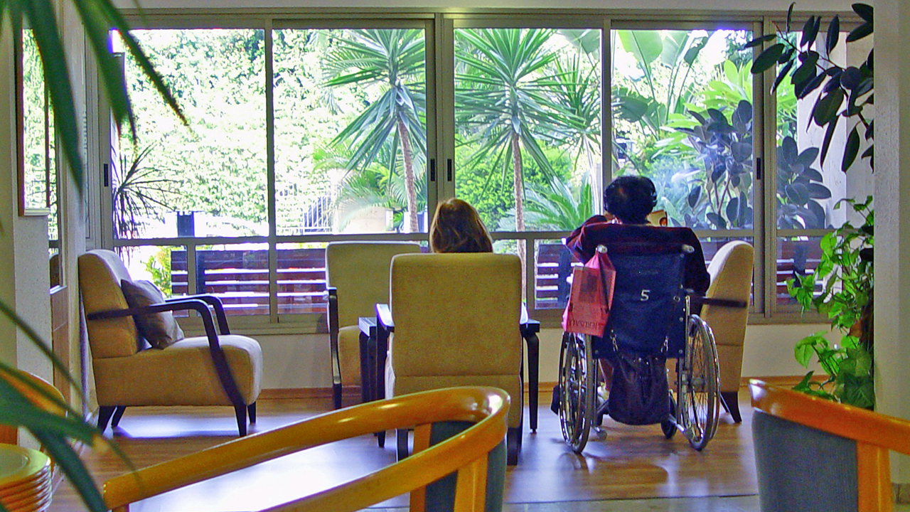 two women sitting in a retirement home