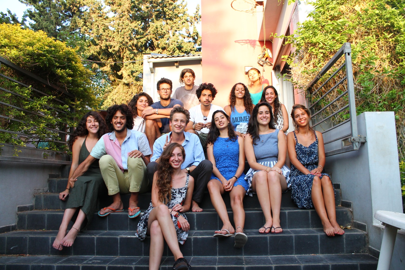 Group of students sitting on steps.