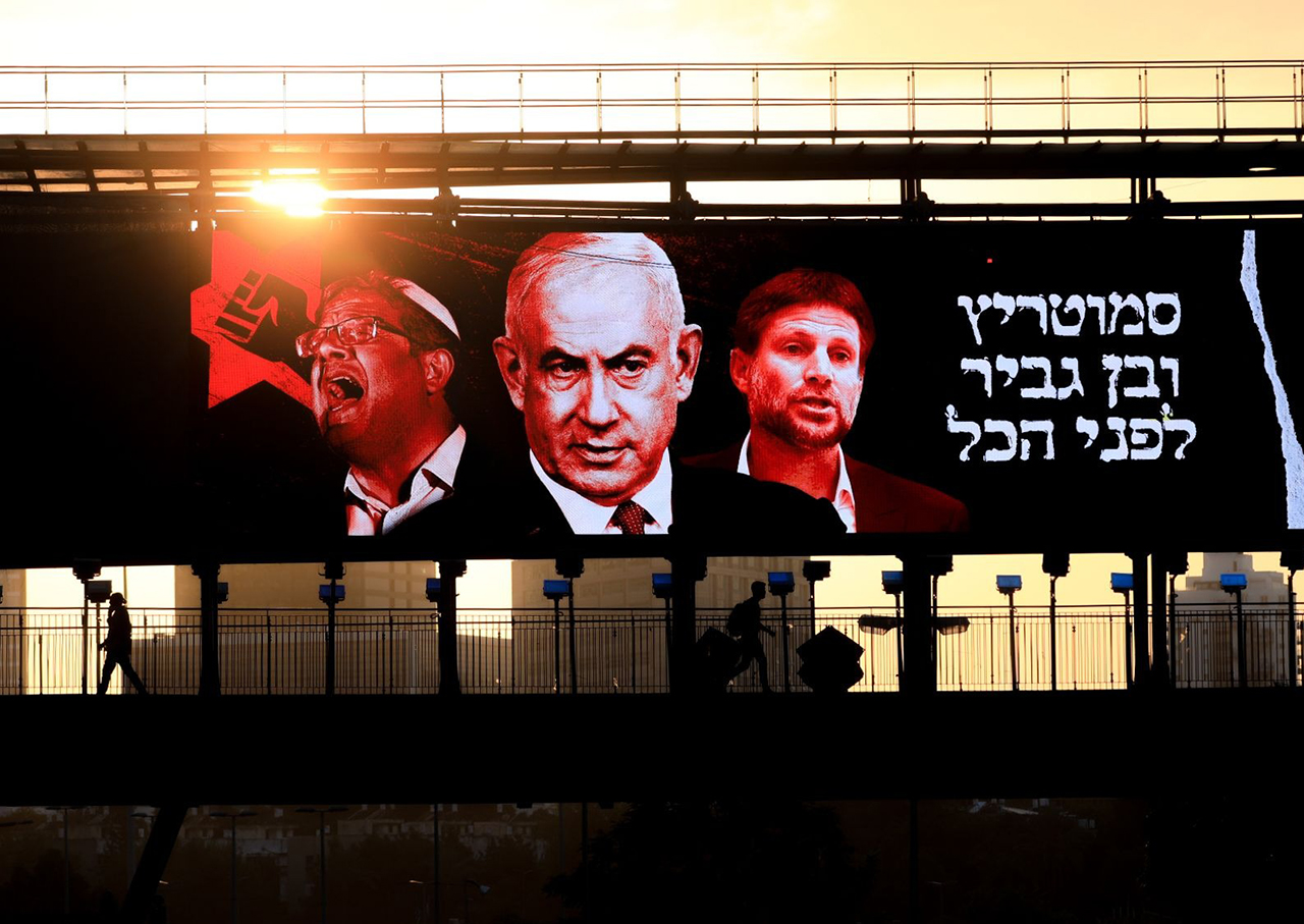 A campaign poster in Tel Aviv shows (from left) Itamar Ben-Gvir, Benjamin Netanyahu and Bezalel Smotrich. (Photo/JTA-Jamal Awad-Flash90)